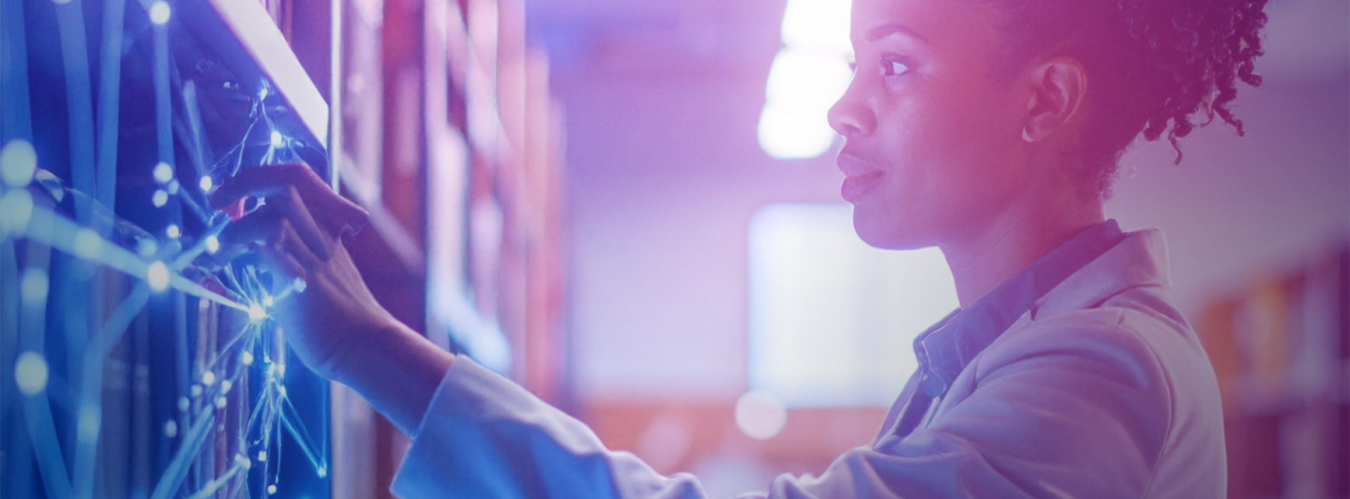 Student choosing a book in the library